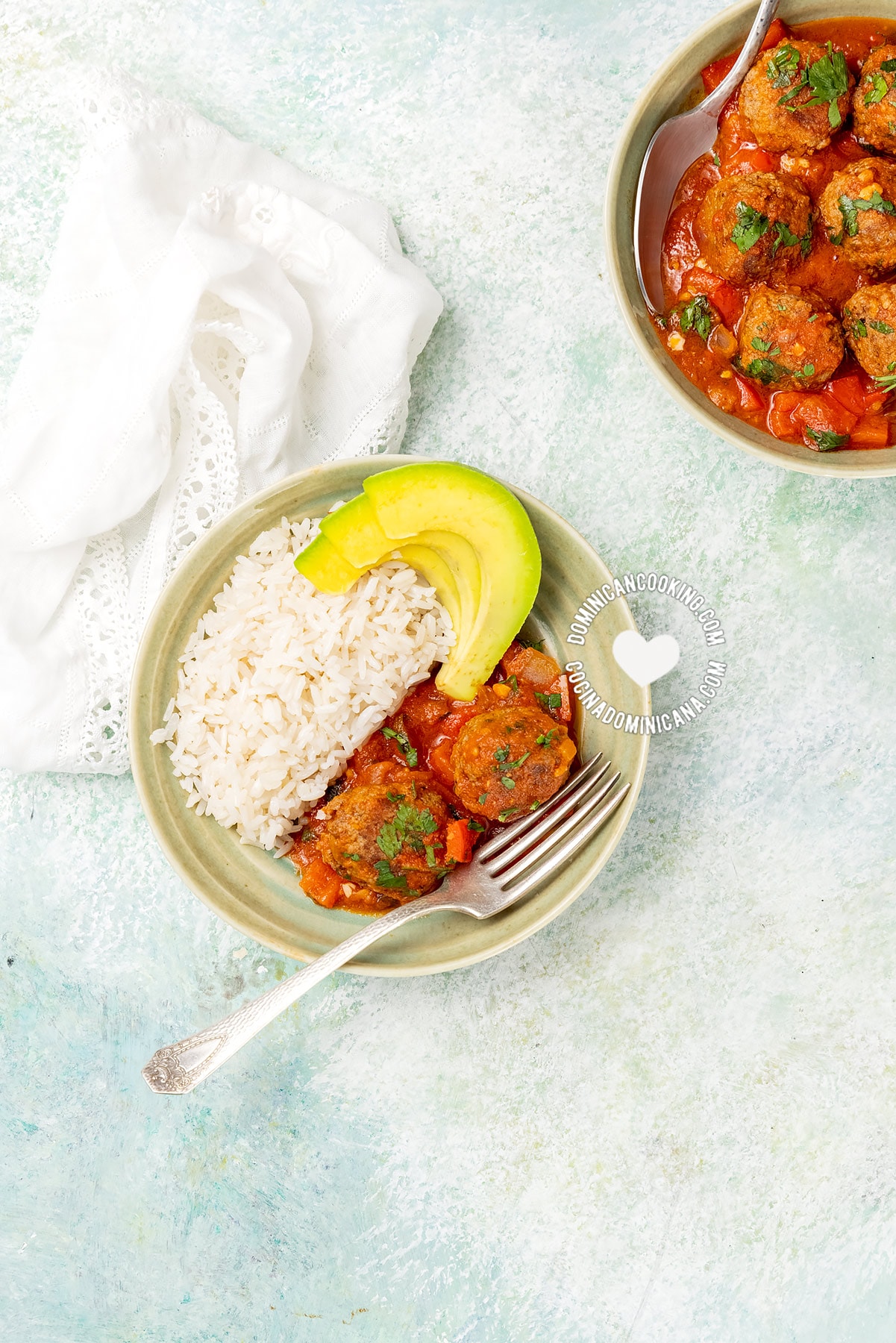 Dominican meat balls, served with rice and avocado.