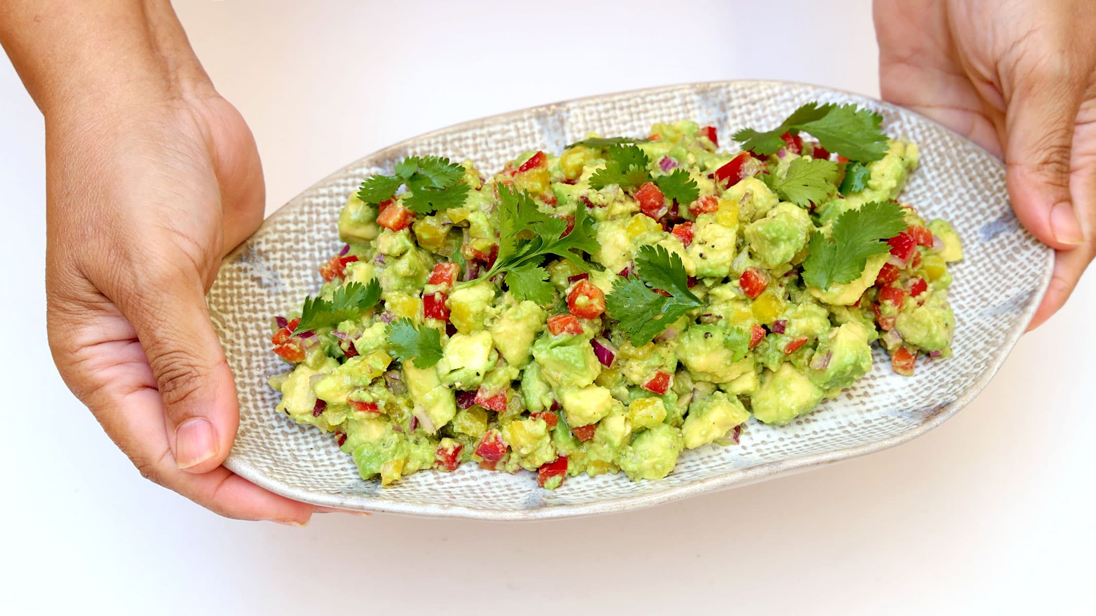Serving avocado salad.