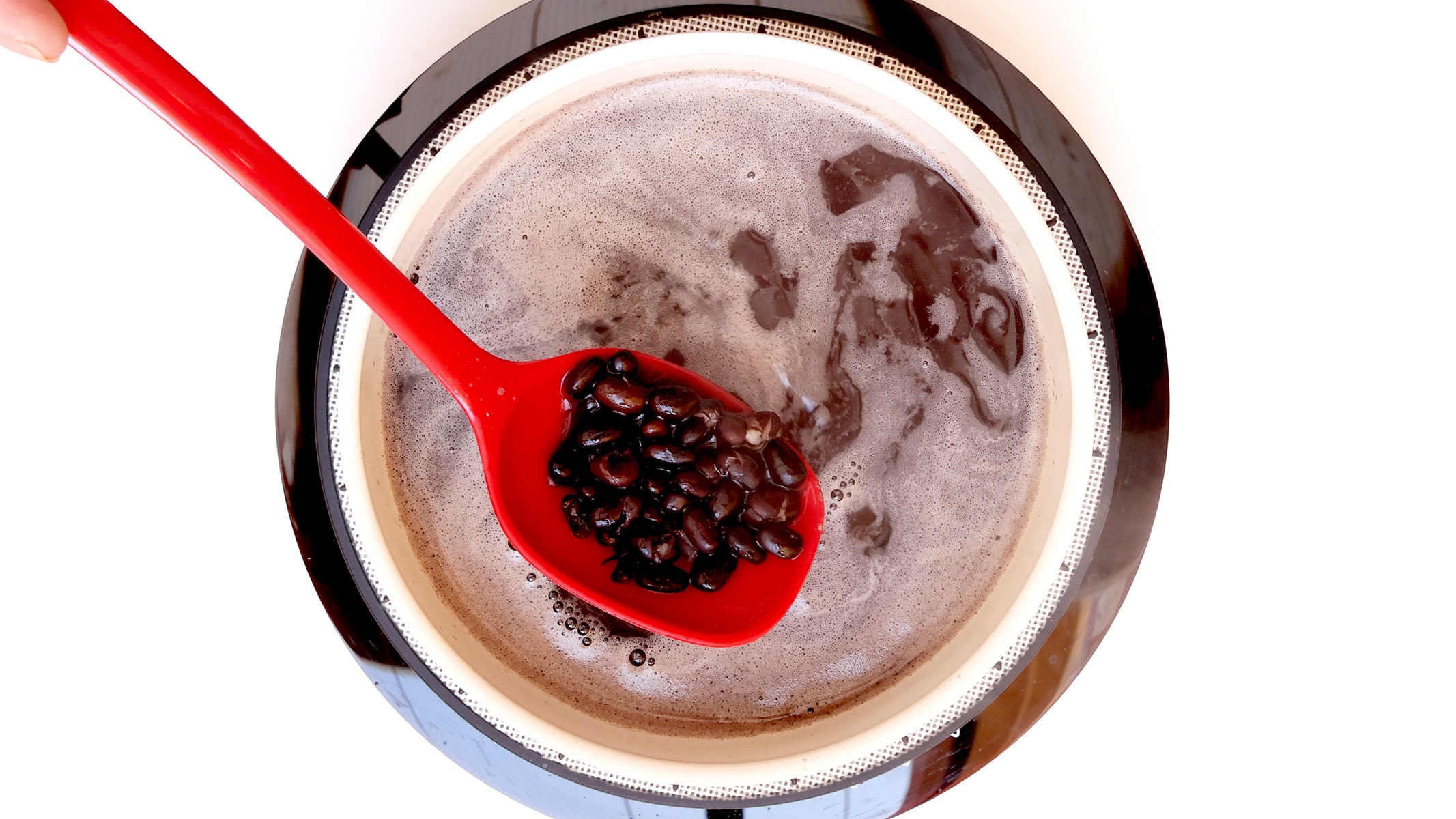 Boiling black beans.