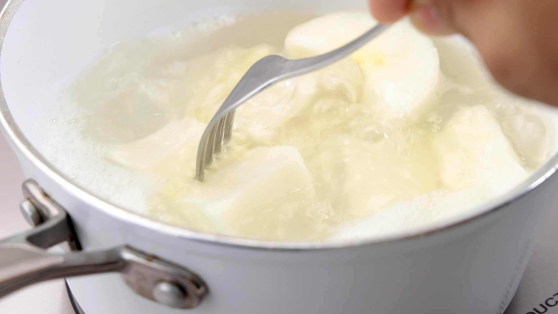Boiling yuca.