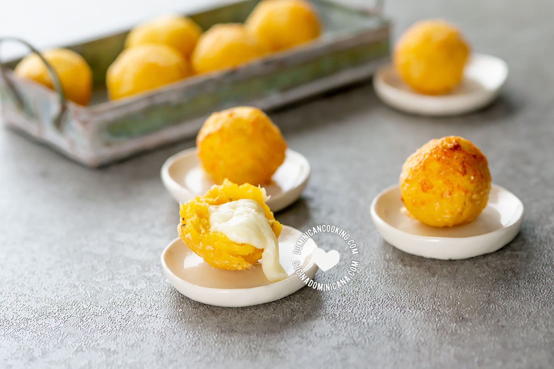 Cheese-crusted ripe plantain balls.