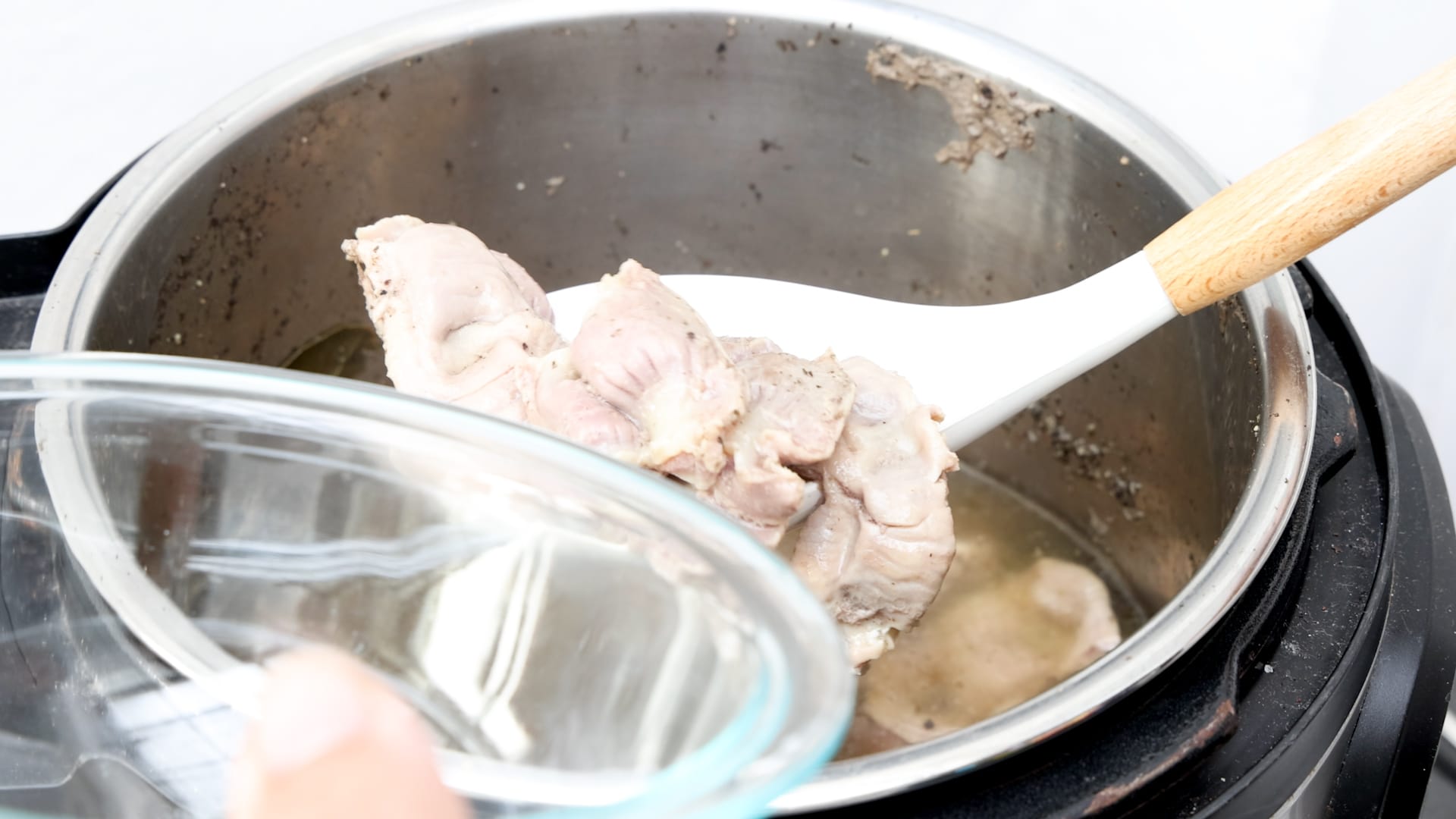 Draining the liquid.