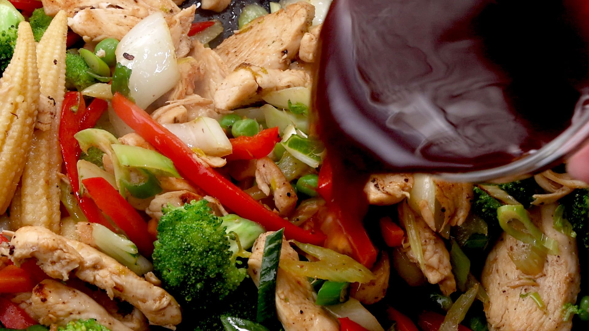 Sauce added to the wok.