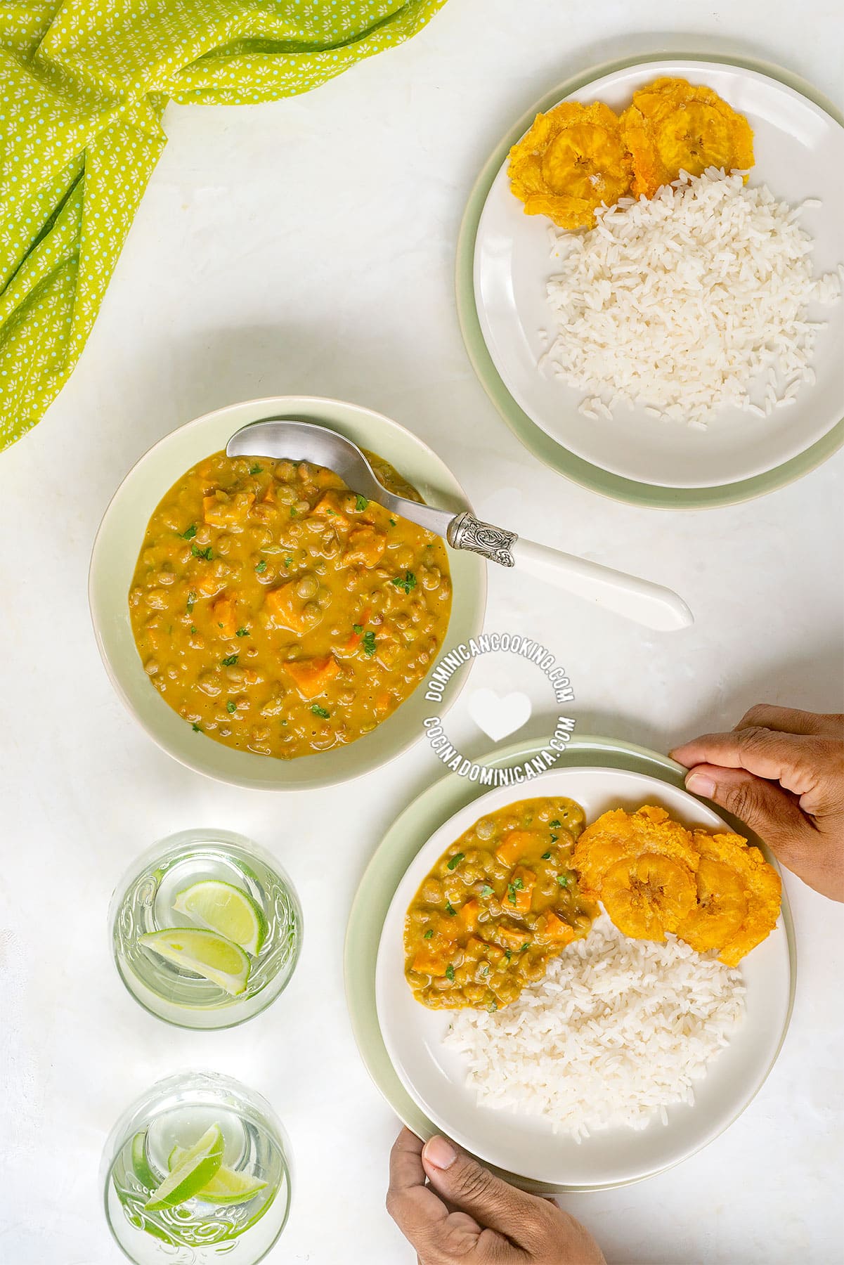 Hands holding bowl of guandules con coco (pigeon peas with coconut).