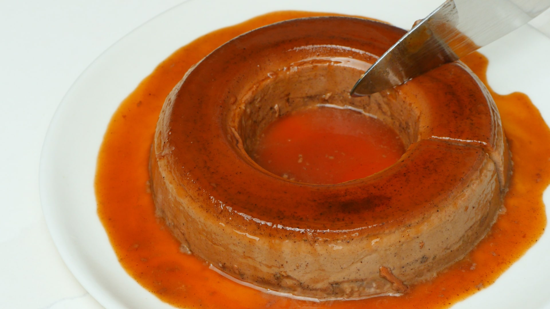 Serving chocolate flan.