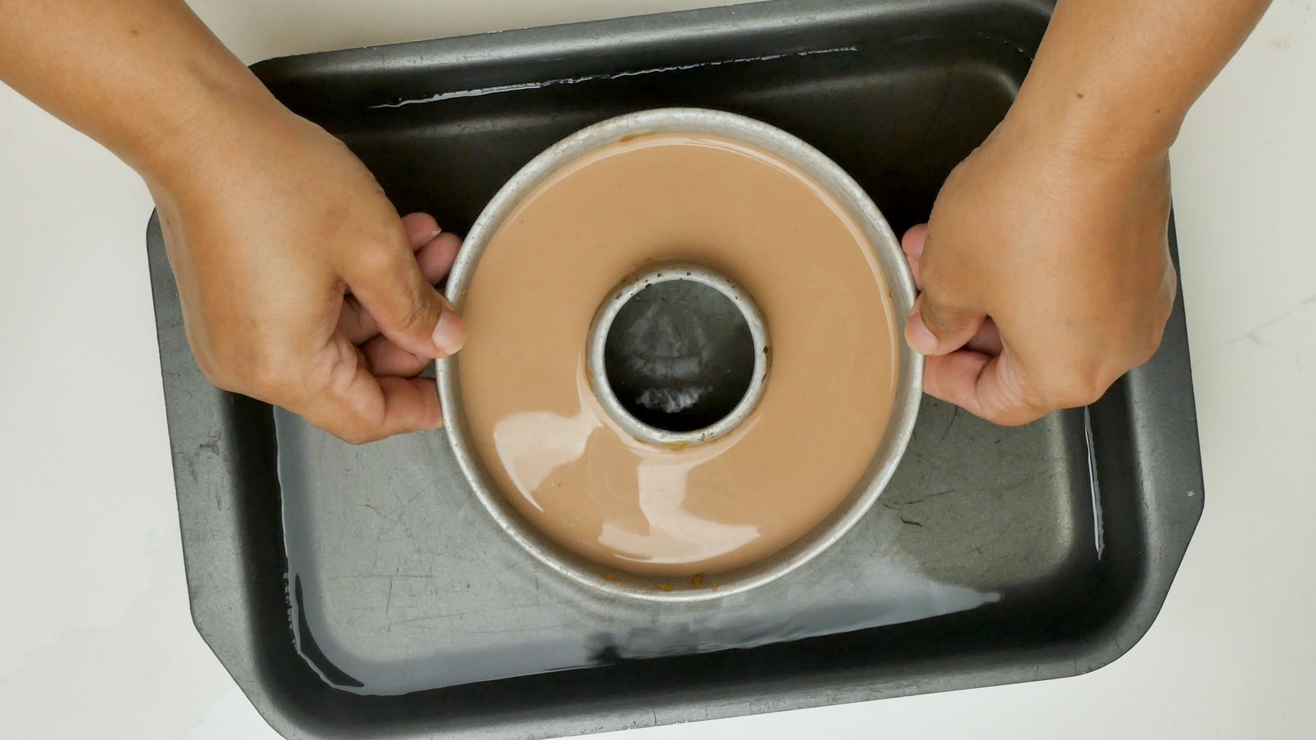 Placing pan in bain-Marie.