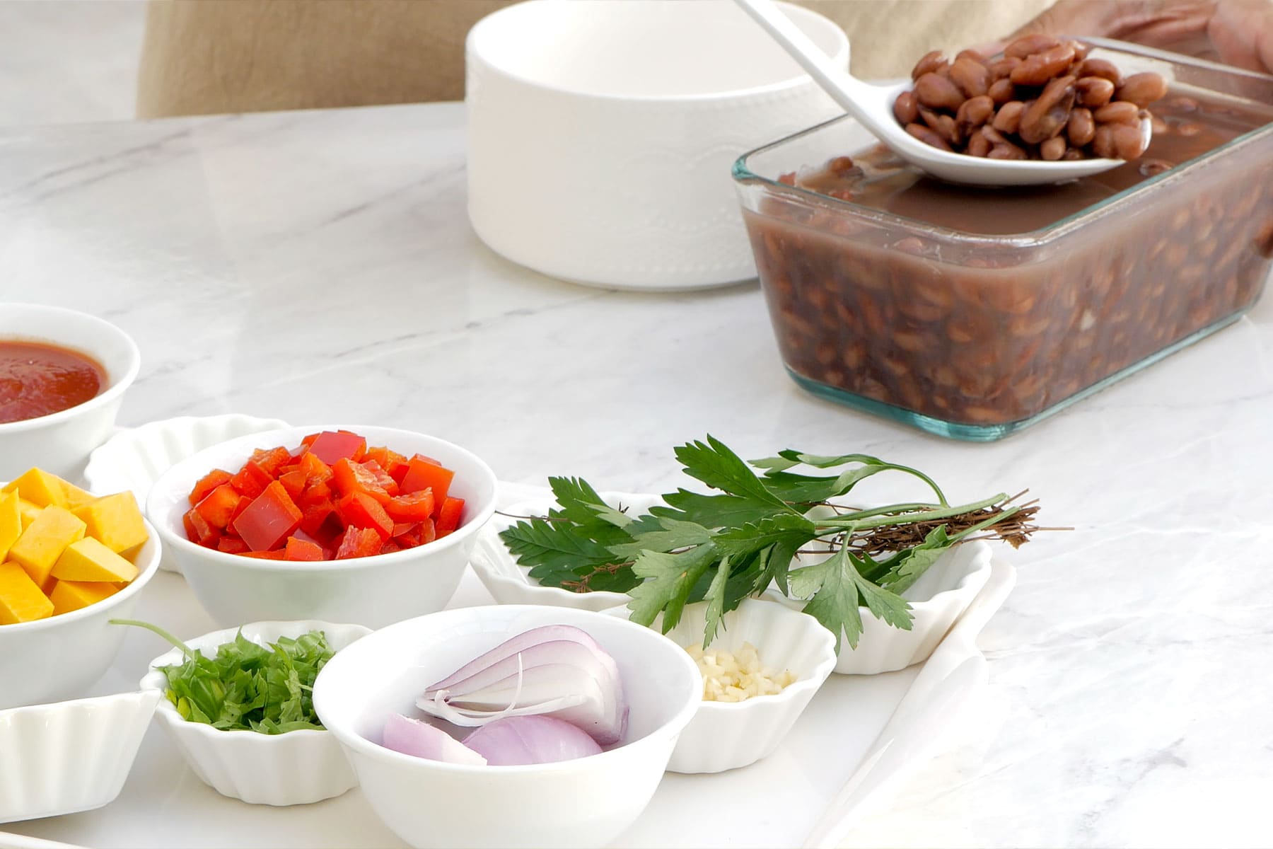 Separating the beans from the water.