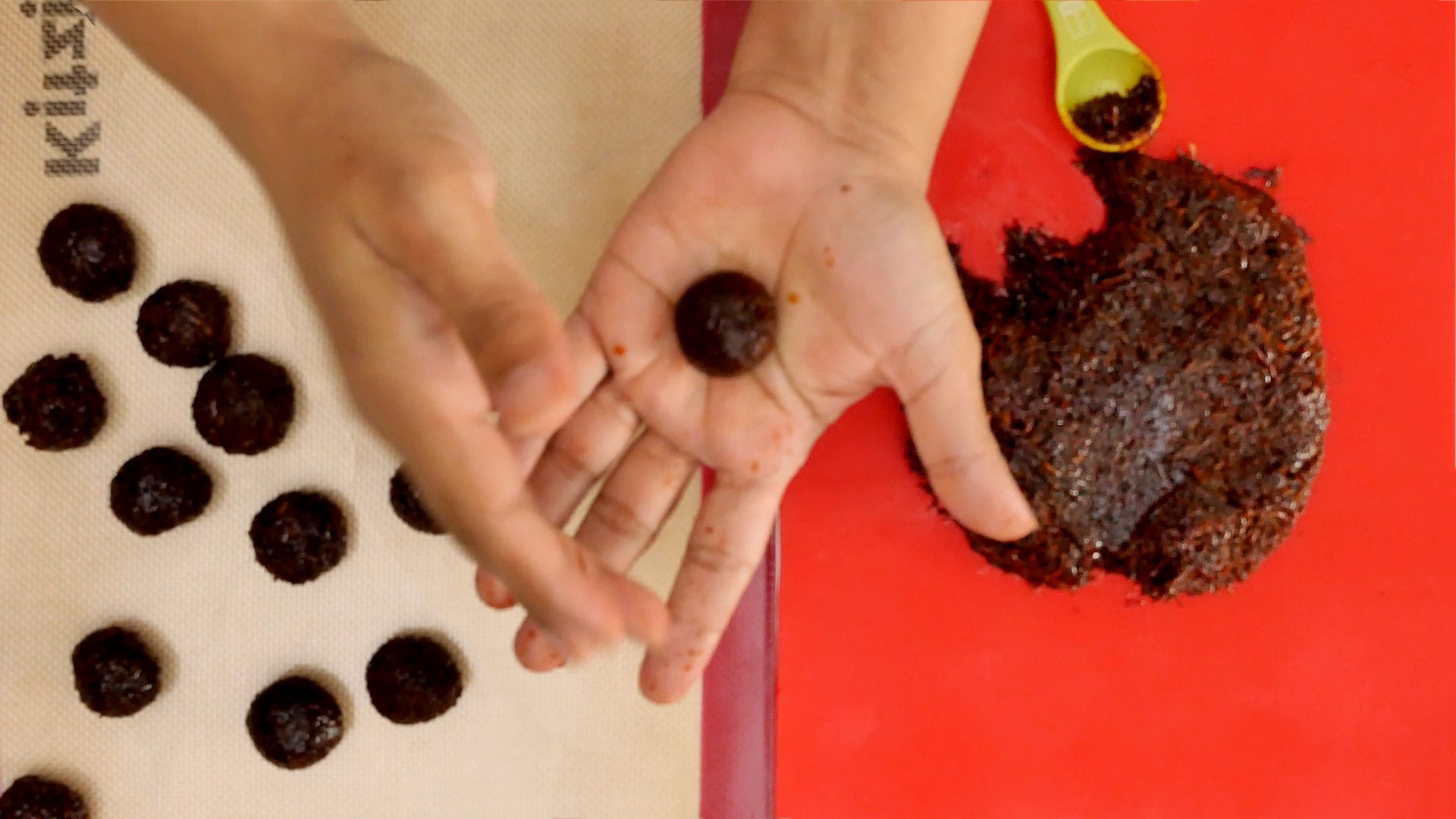 Making coconut balls.
