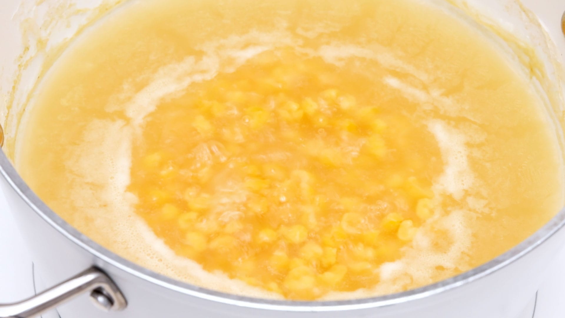 Boiling corn.