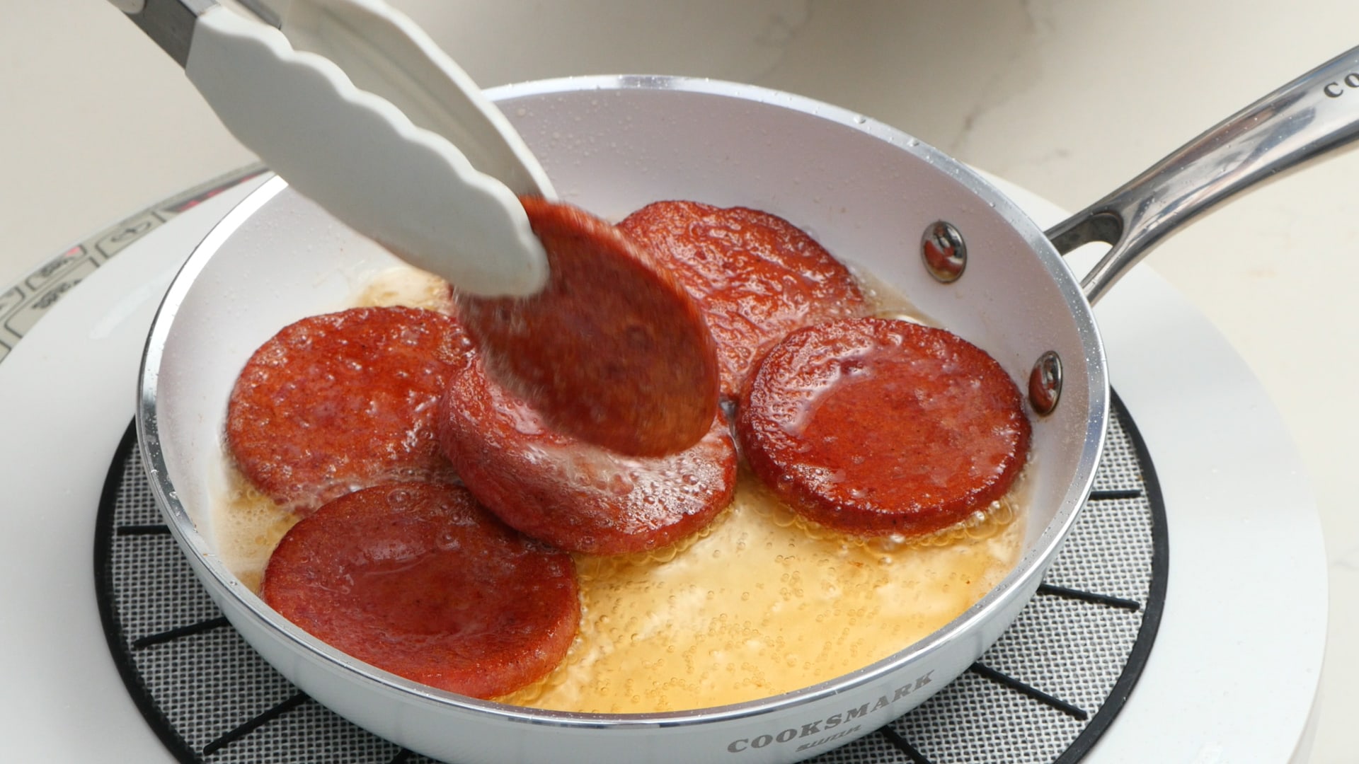 Frying salami.