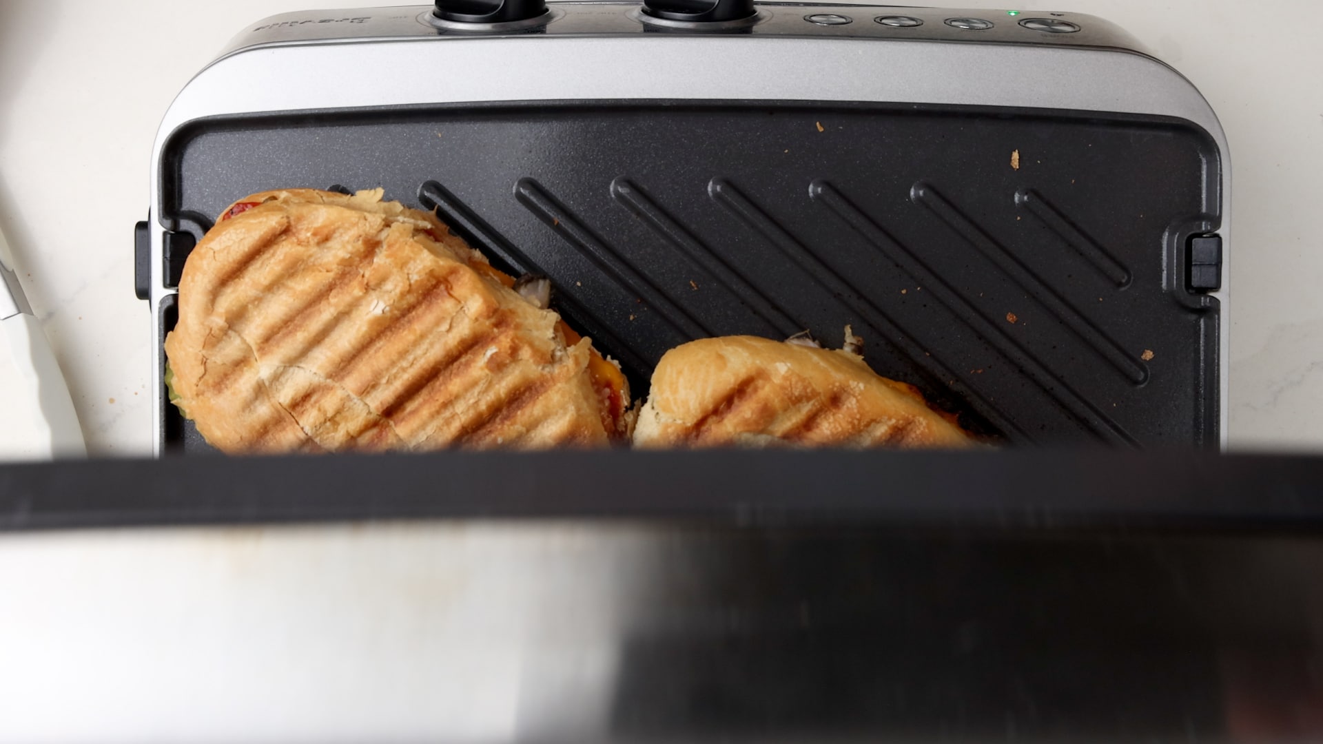 Pressing sandwiches.