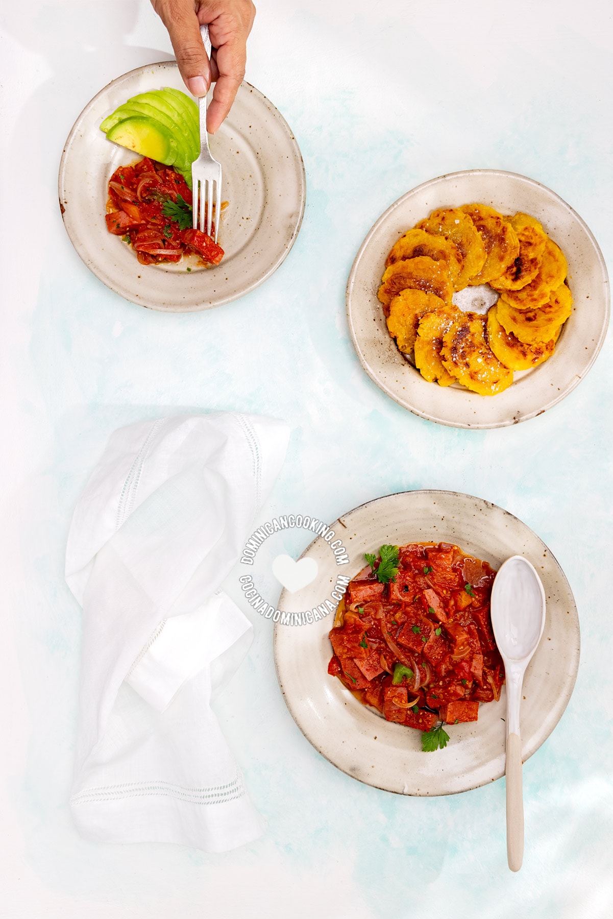 Dominican salami guisado, served with tostones.