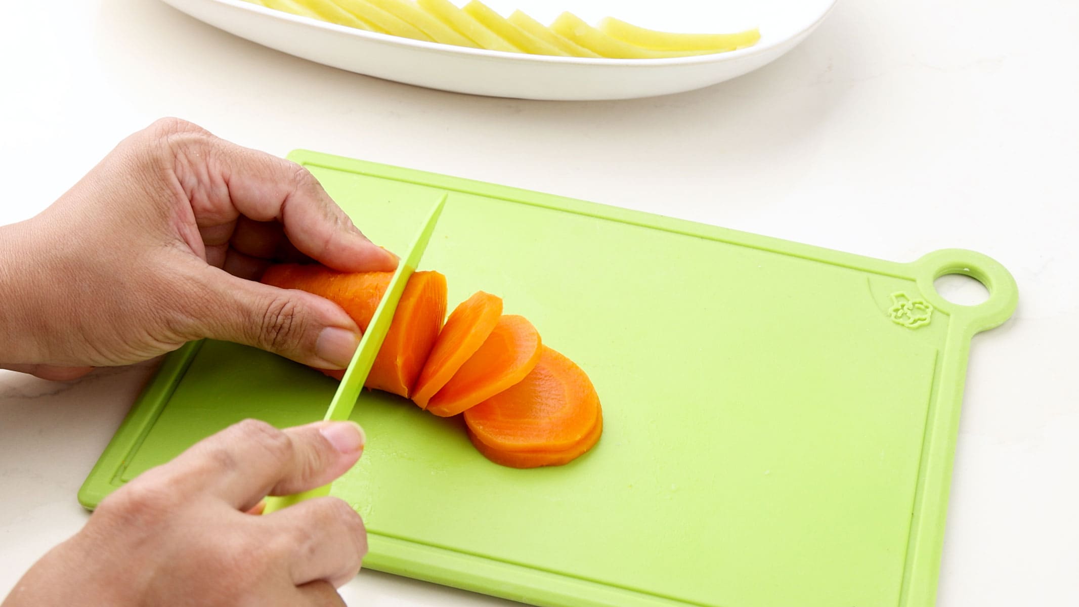Slicing carrots.