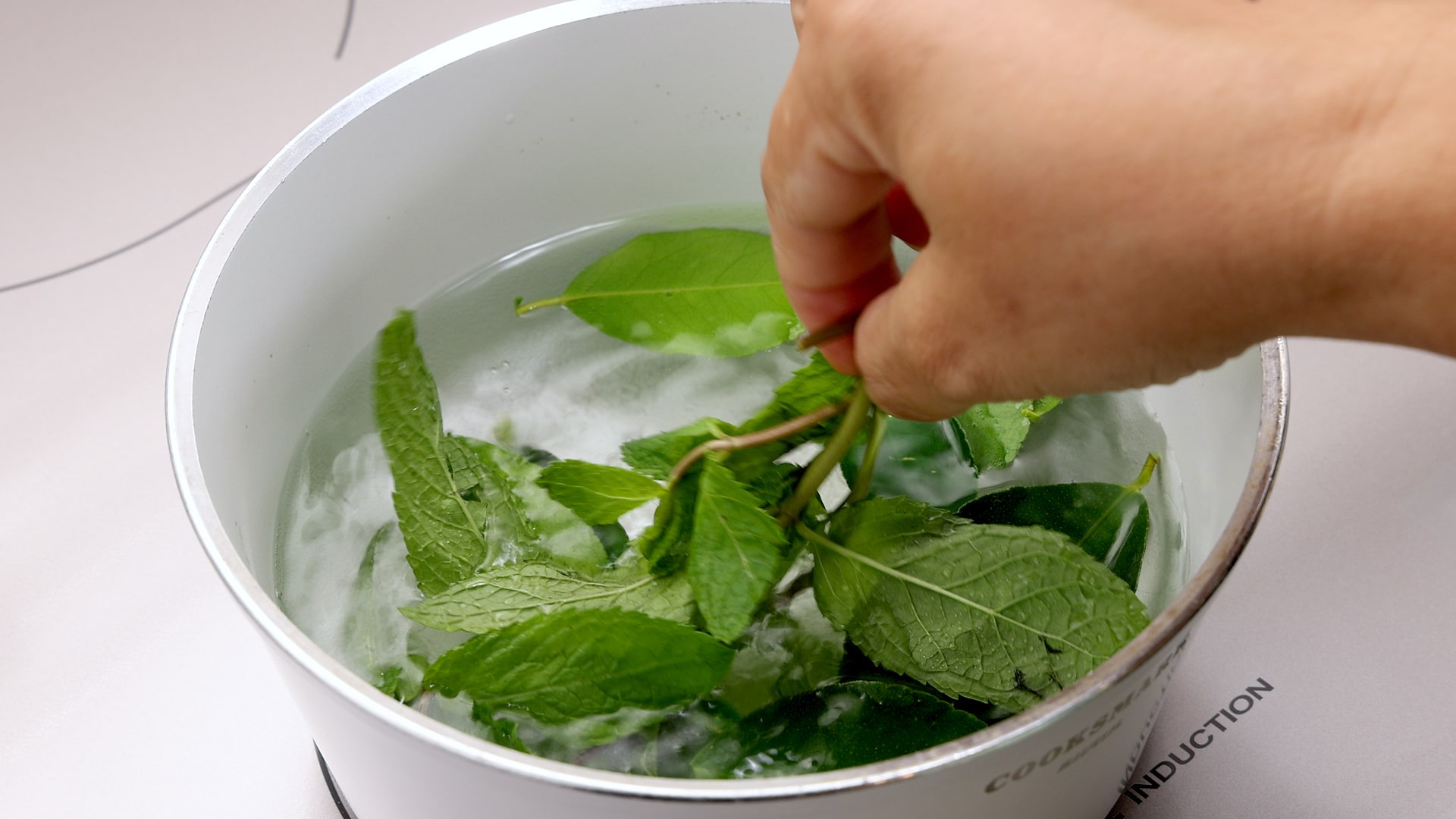 Steeping mint leaves.