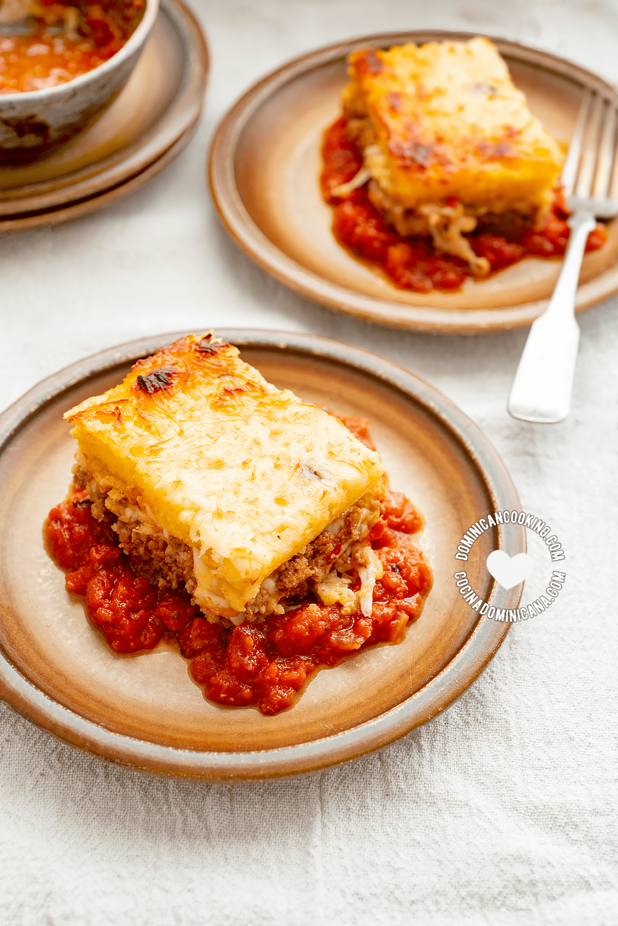 Two portions of cornmeal and beef casserole.